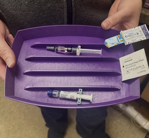 Aiden Gonder and Professor Dias deliver 3D-printed vaccine trays to Keystone Health