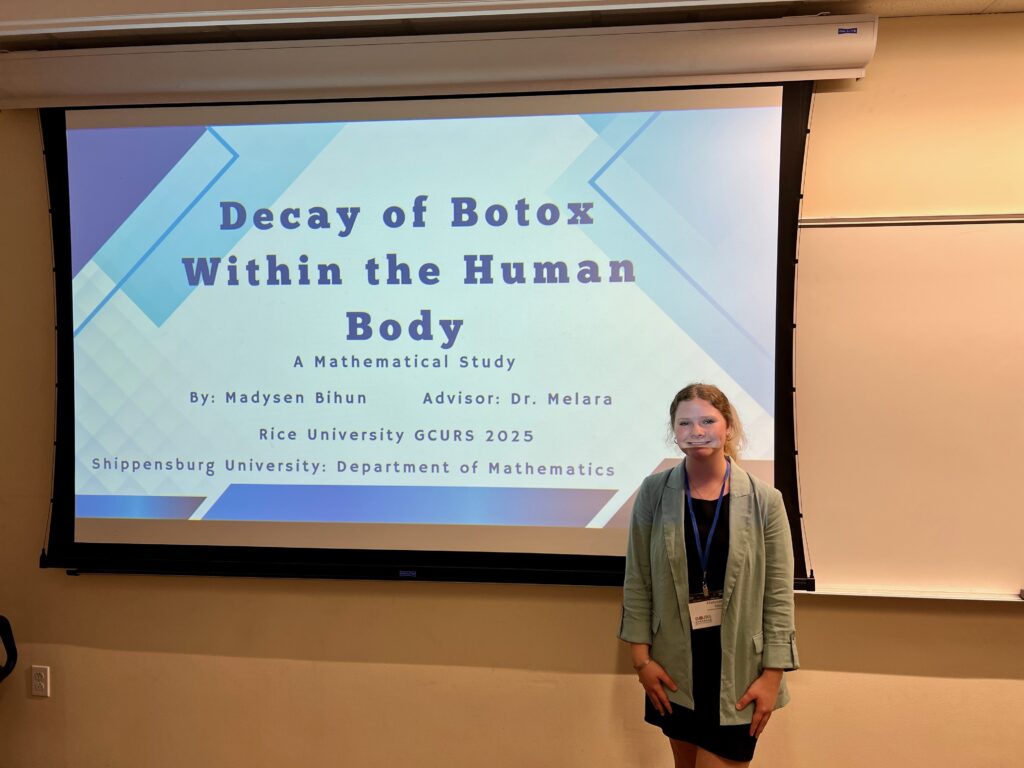 IMG_1687 Cole Pearson and Mady Bihun present at national symposium