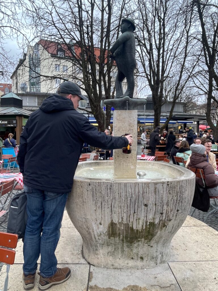 Drs. Feeney & Wildermuth lead travel abroad journey across Europe; fountain at the Viktualienmarkt (Munich’s open-air market)